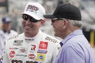 In 2021, Kyle Busch talks with team owner Joe Gibbs (right) during qualifying for the Coca-Cola 600 at Charlotte Motor Speedway - Source: Imagn